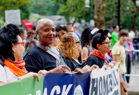 Activists marching together at a climate protest